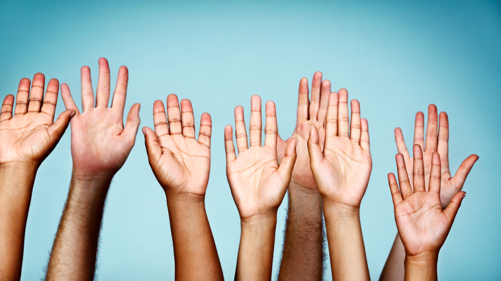 Stoptober Campaign image of people putting their hands up
