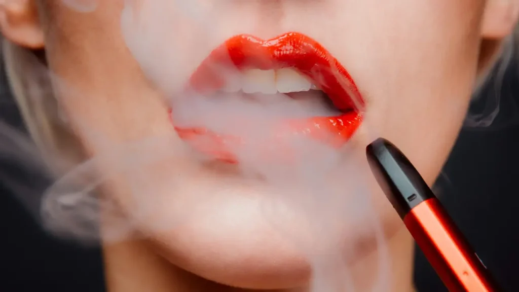 4 Pros vs 4 Cons of Vaping - Image of girl vaping