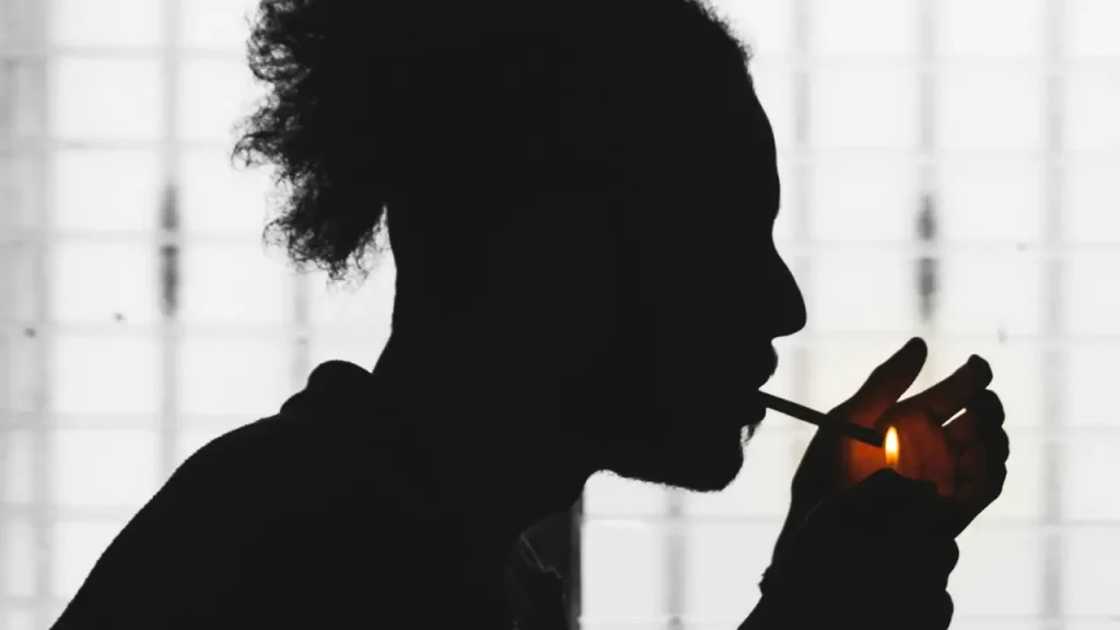 Nicotine Bad For You? Image of man lighting a cigarette