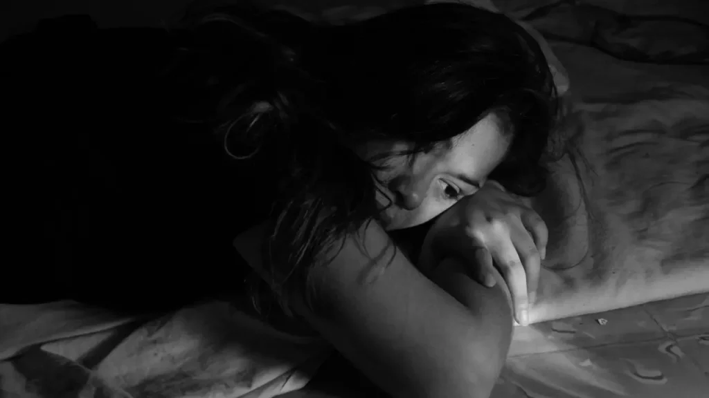 Smoking Relapse image of girl laying on a bed