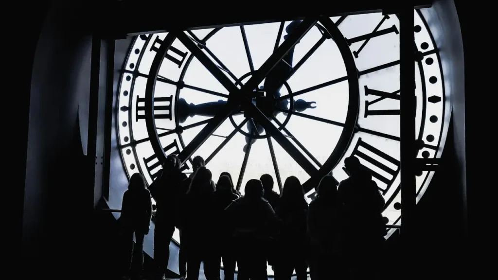 72 Hours After Quitting Smoking. People standing under a clock.
